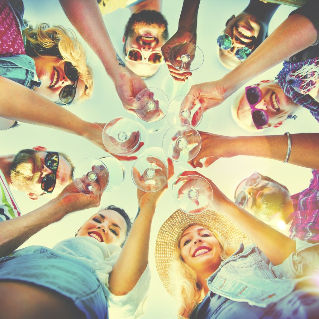 People and clinking glasses
